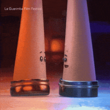 a couple of salt and pepper shakers with faces on them and the words la guarimba film festival below them