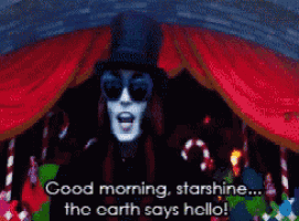a man wearing a top hat and sunglasses says good morning starshine the earth says hello