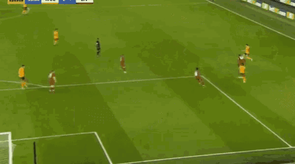 a soccer game is being played on a field with a sign that says bbc on it