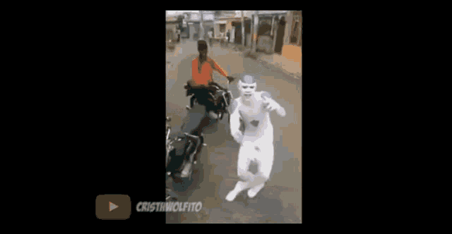a video of a man in a white superhero costume is being uploaded to youtube