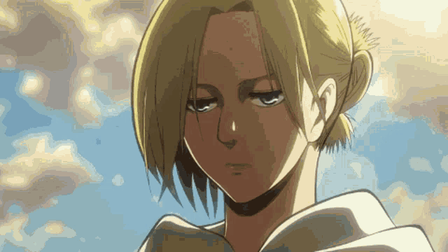 a blonde anime character with a ponytail looks down