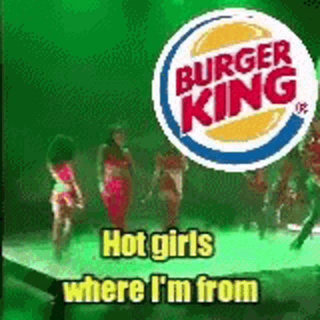 a bunch of girls are dancing on a stage in front of a burger king logo .