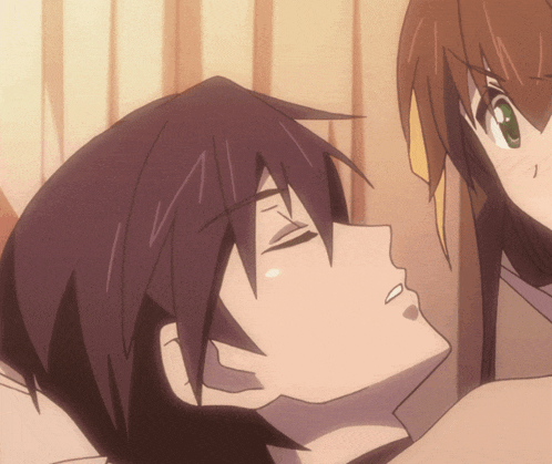 a man with purple hair is laying on a woman 's chest