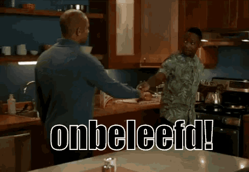 two men are dancing in a kitchen with the words " onbeleefd " written on the counter