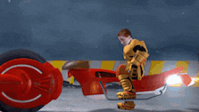 a man in a yellow suit is riding a red motorcycle in the snow