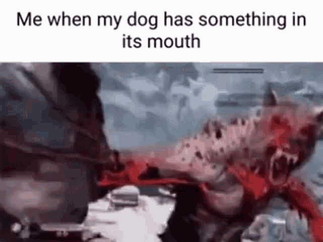 a dog is biting a monster in the mouth .