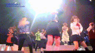 a group of people dancing on a stage with the word persona3 on the bottom right