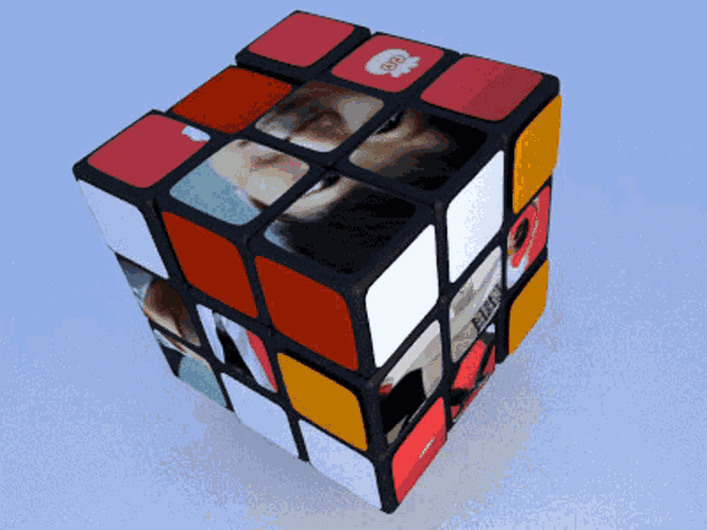 a rubik 's cube with a picture of a man and the word bbc on it