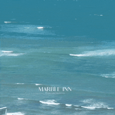 an advertisement for the marble inn shows a picture of the ocean and says live where everyday feels like a vacation