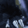a blurred image of a person 's legs in a dark room