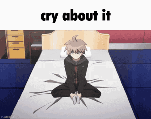 a cartoon character is sitting on a bed with the words cry about it above him