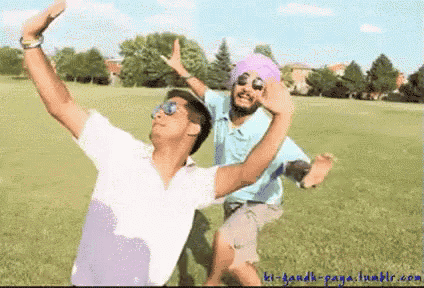 two men in turbans are dancing in a field with the website kl-gandhi-panja.tumblr.com written on the bottom