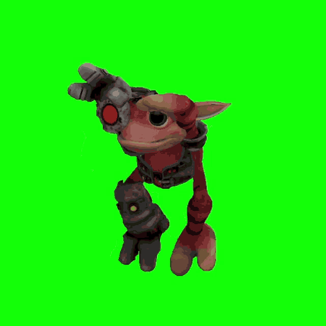 a stuffed animal with a red eye and a glove on a green screen