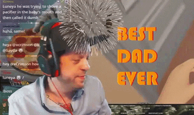 a man wearing headphones is sitting in front of a screen that says " best dad ever "