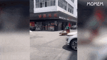 a car is driving down a street with a pair of shoes on the side of it .