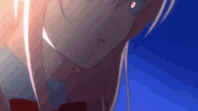 a close up of a girl 's face with a light coming out of her eyes .