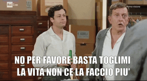 two men standing next to each other with the words " no per favore basta toglimi la vita non ce la faccio piu "