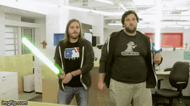 two men holding lightsabers in an office with imgflip.com at the bottom of the screen