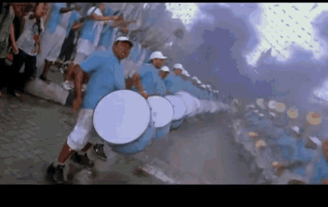 a group of men playing drums in a line