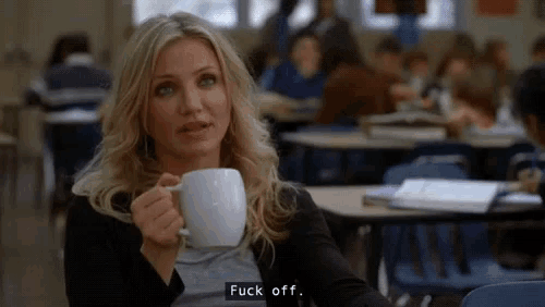 a woman is holding a cup of coffee and says " fuck off "