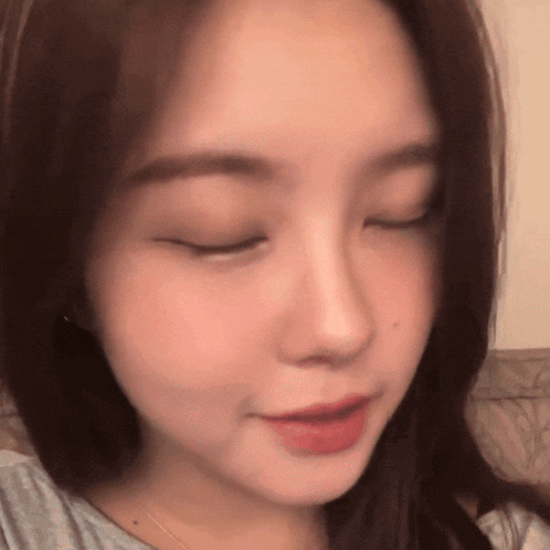 a woman with her eyes closed and her mouth open