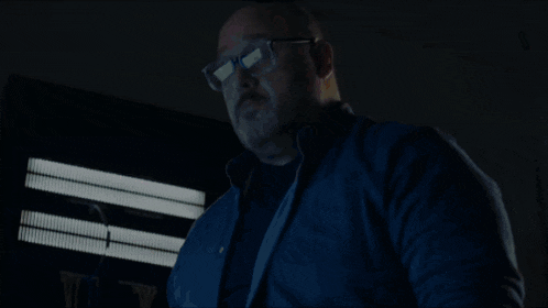 a man is falling through the air in a room with a fireplace