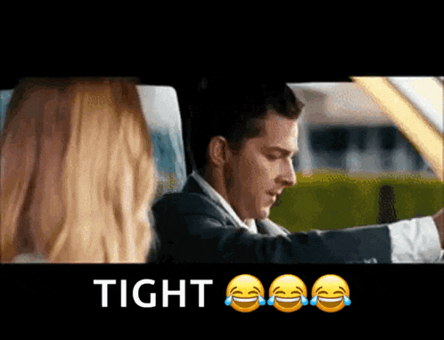 a man in a suit is driving a car and the word tight is on the bottom