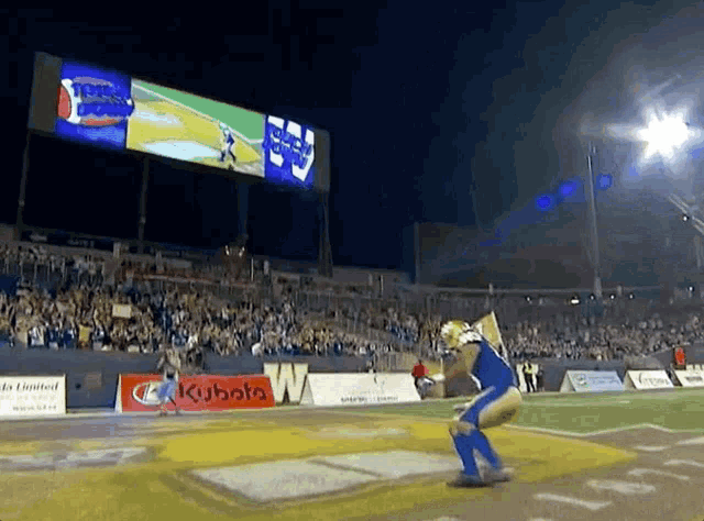 a football game is being played at a stadium with a kubota sign in the background