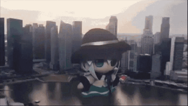 a doll with a hat is in front of a city skyline