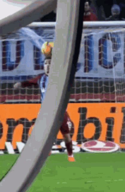 a soccer player with the number 13 on his jersey kicks the ball