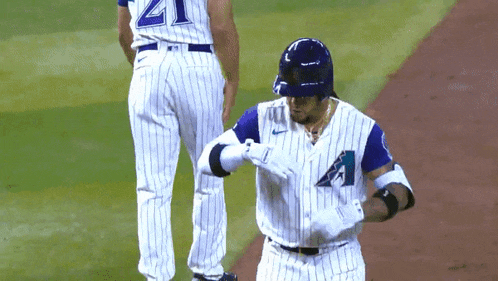a baseball player wearing a white and blue uniform with the letter a on it
