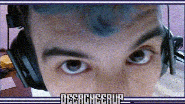 a close up of a person 's eyes with the words disgracecorp written in the corner