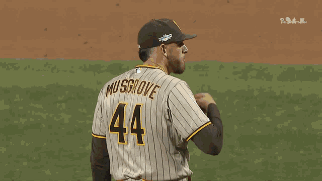 a man wearing a san diego baseball jersey