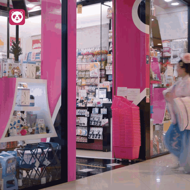 a pink store with a pink panda logo on the top