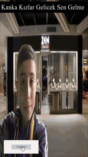 a boy is standing in front of a store called zen