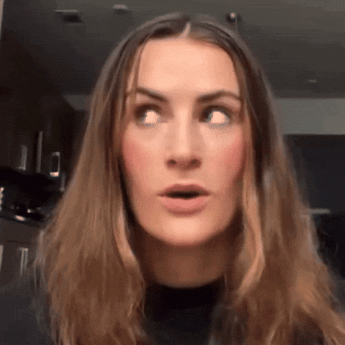 a woman making a surprised face with her mouth open