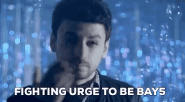 a man is fighting urge to be bays in a blurry photo .