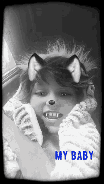 a black and white photo of a child with the words my baby on the bottom right
