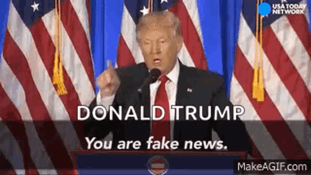 donald trump is giving a speech at a podium in front of an american flag .