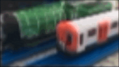a blurred image of a train with the number 0 on the front