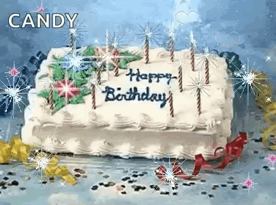 a birthday cake with candles on it and the words `` happy birthday '' on it .