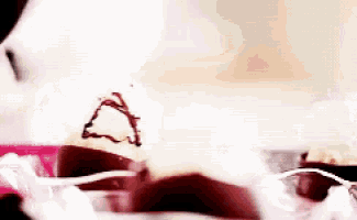 a close up of a piece of chocolate cake with a heart on top