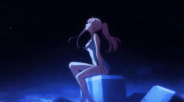 a girl in a bathing suit is sitting on a rock looking up at the sky