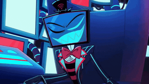 a cartoon character with a blue head and a red bow tie is sitting in front of a computer screen .