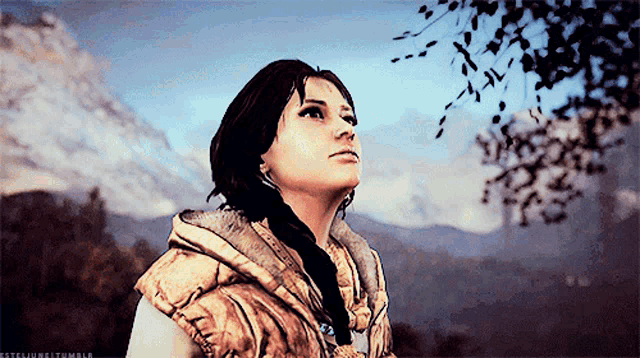 a woman in a video game looks up at the sky while standing in front of a mountain
