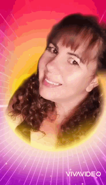 a woman with curly hair is smiling and looking at the camera on a pink and purple background .