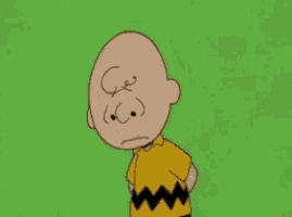 a cartoon character named charlie brown with a sad face on his forehead