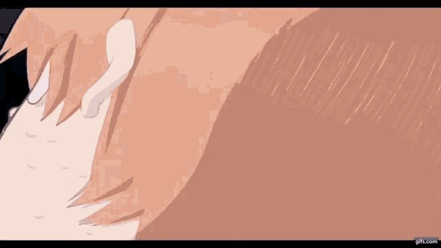 a close up of a person 's face with their eyes closed and their ear visible .