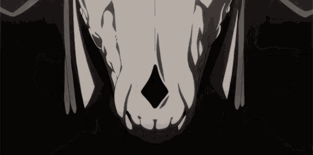 a close up of a skull with smoke coming out of it