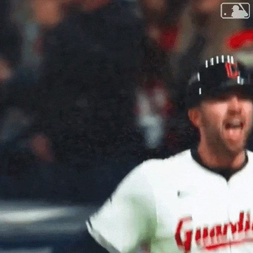 a close up of a baseball player wearing a uniform with the word guard on it